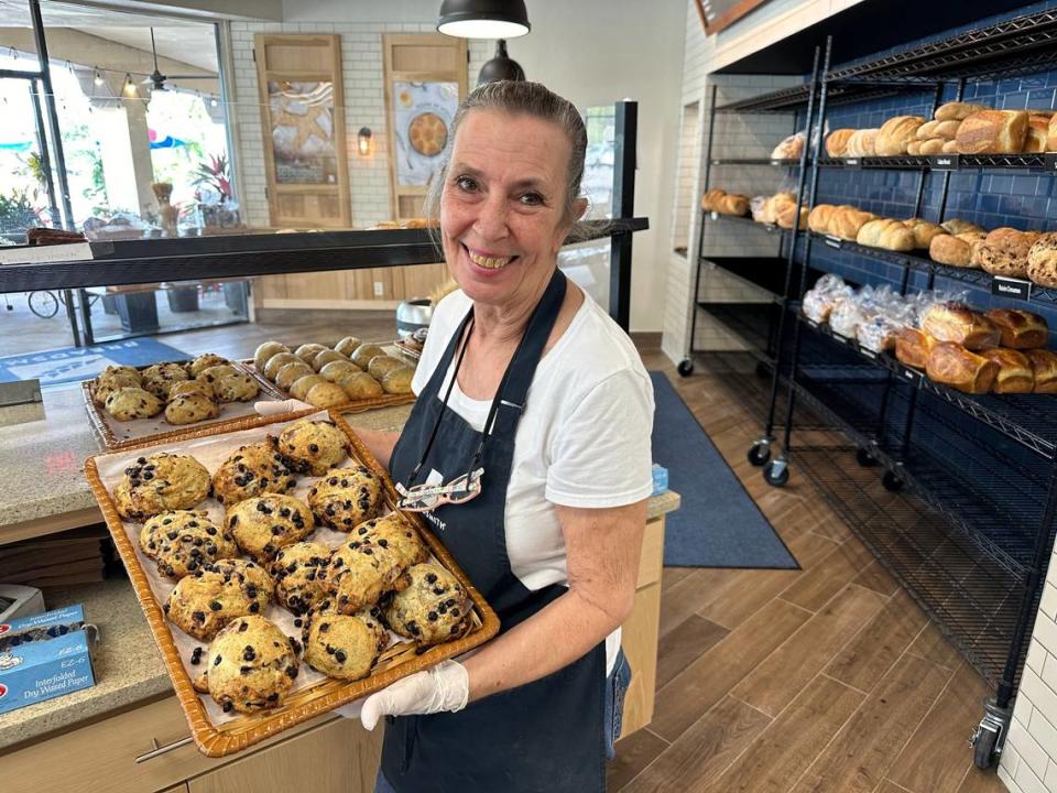 Tina Albrecht holds a tray of lemon-blueberry scones at Breadsmith, 6425 Manatee Avenue W. in the Fountain Court shopping center.