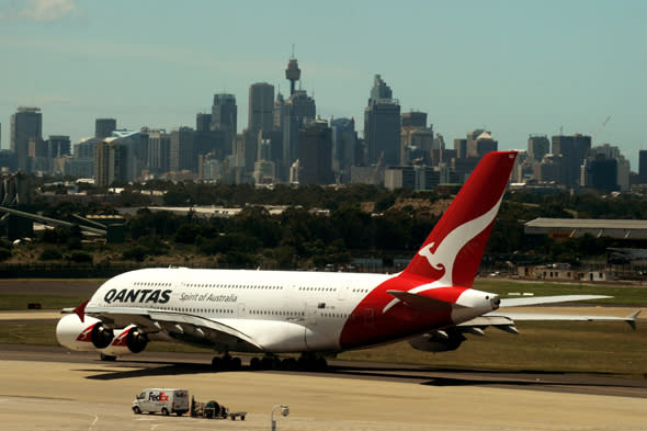 The first Qantas plane to depart since the airline was grounded taxis on the runway in preperation for take off at Sydney International Airport in Sydney, Monday, Oct. 31, 2011. Qantas planes are set to fly again after Fair Work Australia ordered an end to union strikes and the airline's grounding of its fleet. Passengers have been stranded in Australia and around the world over the weekend, since the airline grounded 108 planes. (AAP Image/Tracey Nearmy) NO ARCHIVING ** STRICTLY EDITORIAL USE ONLY **