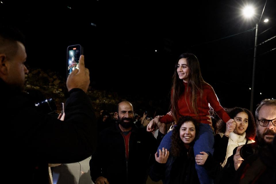 Newly released Palestinian prisoner Rouba Assi is carried by supporters in Ramallah in the occupied West Bank on November 28, 2023.