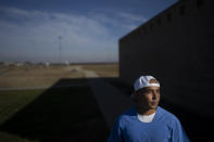Joseph Sena, 27, stands for a photo at Valley State Prison in Chowchilla, Calif., Friday, Nov. 4, 2022. Sena spent years trying to make himself a better person after spending nearly half of his 27 years in prison for killing a man. He took courses in poetry and mental health and other topics at a central California prison, hoping to be seen as fit for parole and ready to live outside prison if the day he was free ever came. (AP Photo/Jae C. Hong)