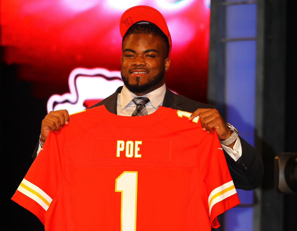 NEW YORK, NY - APRIL 26: Dontari Poe of Memphis holds up a jersey as he stands on stage after he was selected #11 overall by the Kansas City Chiefs in the first round of the 2012 NFL Draft at Radio City Music Hall on April 26, 2012 in New York City. (Photo by Al Bello/Getty Images)