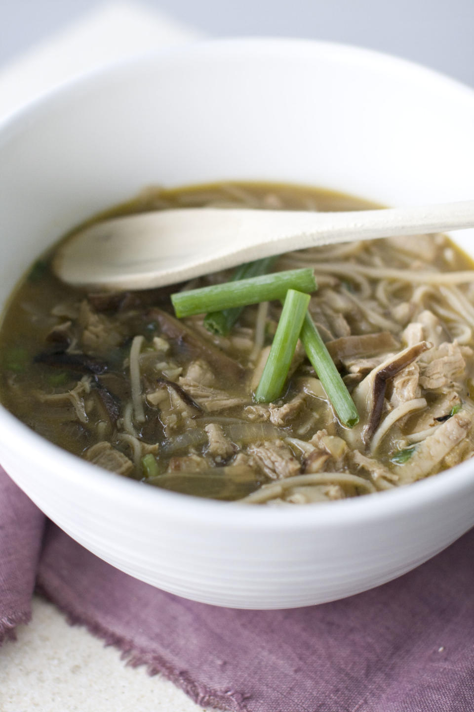 This Aug. 26, 2013 photo shows Shiitake mushroom ginger noodle soup with garlic pork in Concord, N.H. (AP Photo/Matthew Mead)