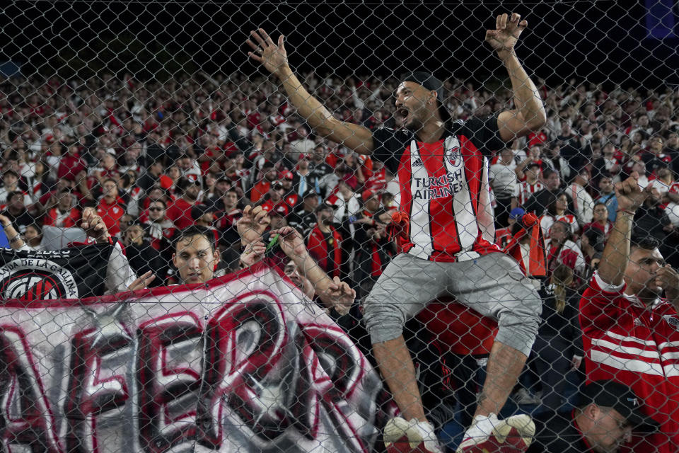 Argentina's River Plate fans wait for the start of a Copa Libertadores Group H soccer match against Uruguay's Nacional in Montevideo, Uruguay, Tuesday, May 7, 2024. (AP Photo/Matilde Campodonico)