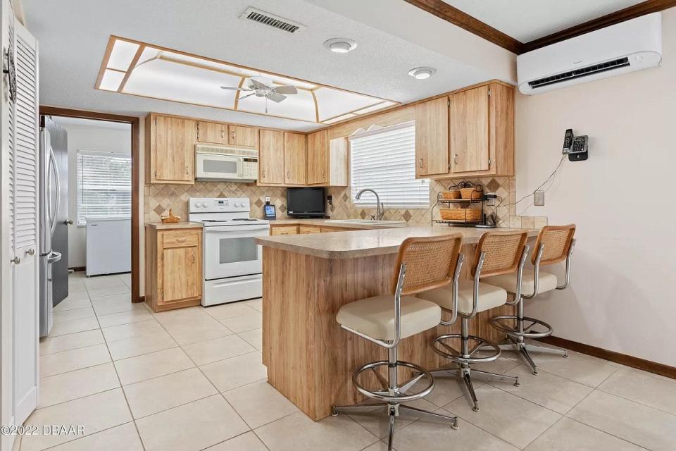 Enjoy views of the five-acre property from the window above the sink of this open kitchen.