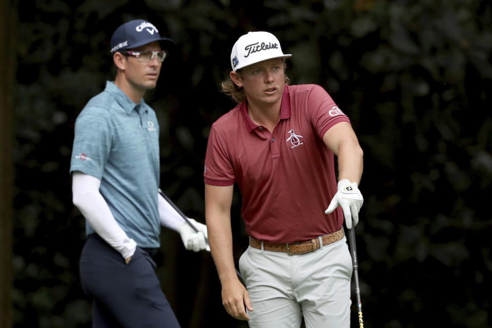 Cameron Smith, right, watches his tee shot as Dylan Frittelli prepares to hit on the seventh hole during the final round of the Masters golf tournament Sunday, Nov. 15, 2020, in Augusta, Ga. (Curtis Compton/Atlanta Journal-Constitution via AP)