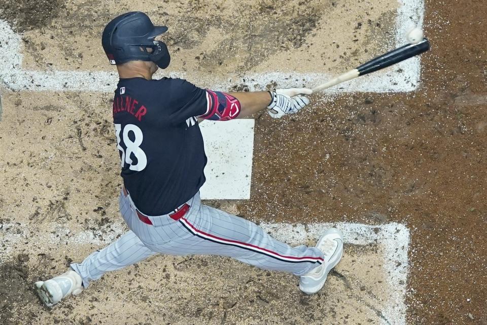 Minnesota Twins' Matt Wallner hits an RBI sacrifice fly during the fourth inning of a baseball game against the Milwaukee Brewers Tuesday, April 2, 2024, in Milwaukee. (AP Photo/Morry Gash)