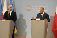 Ukrainian Prime Minister Denys Shmyhal, left, and Poland's Prime Minister Donald Tusk make statements to the media following talks in Warsaw, Poland, Thursday, March 28, 2024. The prime ministers of Ukraine and Poland said they made progress Thursday toward meeting demands of Polish and western European farmers who want restrictions on cheap Ukrainian food imports that they say undermine their livelihoods, but they announced no breakthrough. (AP Photo/Czarek Sokolowski)