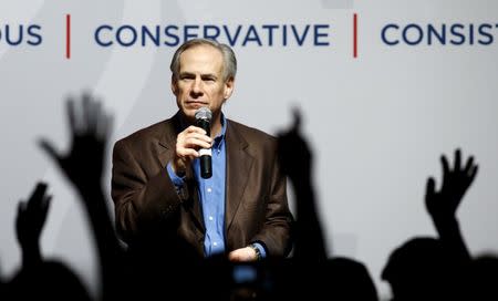 Texas Governor Greg Abbott speaks at a campaign rally for U.S. Republican presidential candidate Ted Cruz in Dallas, Texas February 29, 2016. REUTERS/Mike Stone/File Photo - RTSOUHS