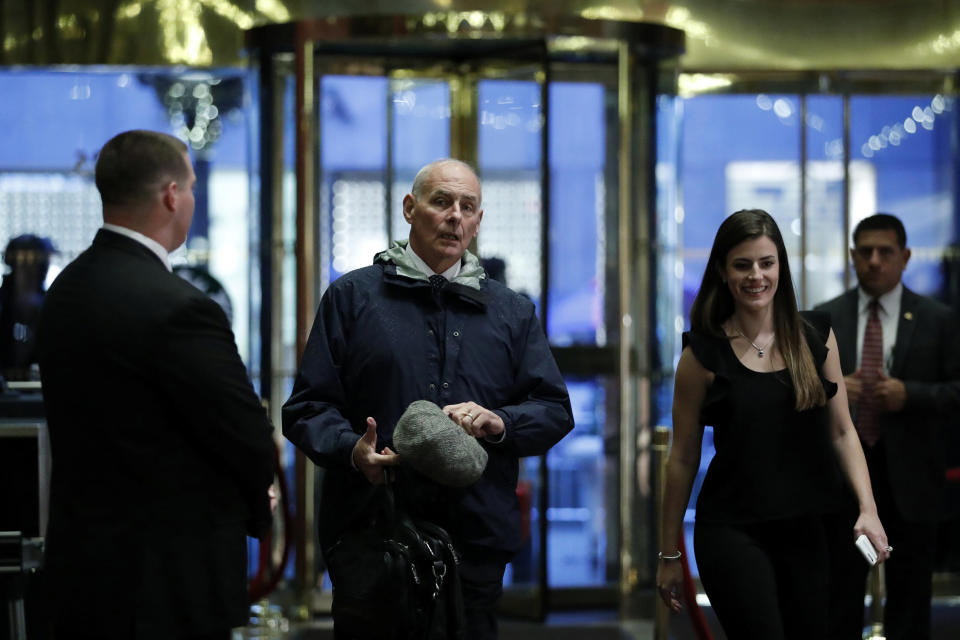 Retired Marine Corps general John Kelly is escorted by Madeleine Westerhout (R) as he arrives at Trump Tower to meet with U.S. President-elect Donald Trump in New York, U.S., November 30, 2016. REUTERS/Lucas Jackson