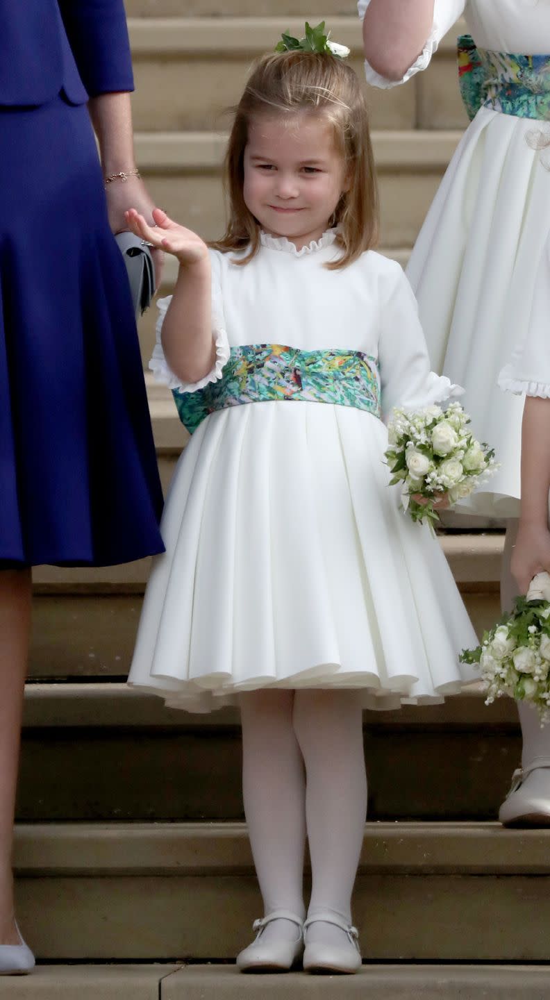 Princess Charlotte waves to the crowd.