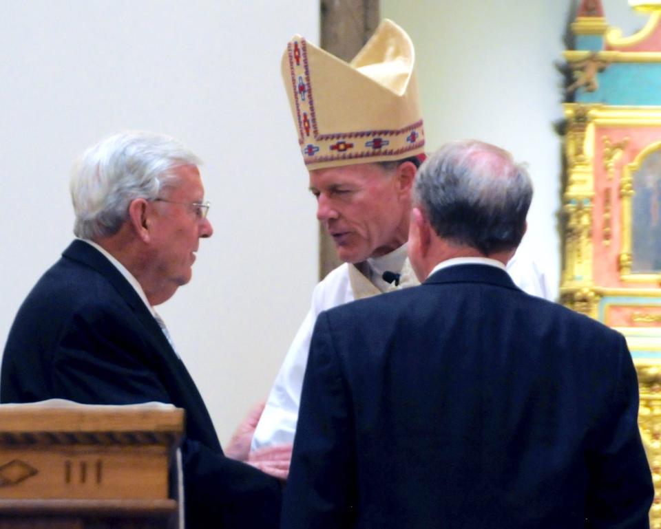 20150604 Elder M. Russell Ballard of the Quorum of the Twelve Apostles greets Archbishop John C. Wester whose installation mass was held in the Cathedral Basilica in Santa Fe, N.M., on June 4. | Clyde Miller , The New Mexican