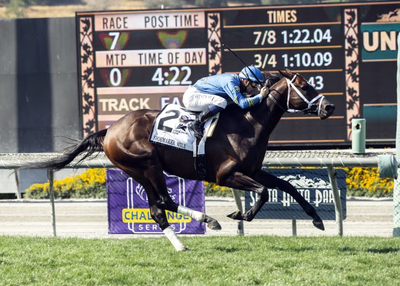 In this image provided by Benoit Photo, Smooth Like Strait, with Umberto Rispoli aboard, wins the Grade I $300,000 Shoemaker Mile horse race Monday, May 31, 2021, at Santa Anita Park in Arcadia, Calif. (Benoit Photo via AP)