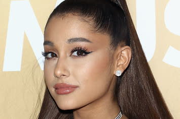 Ariana Grande poses on the red carpet