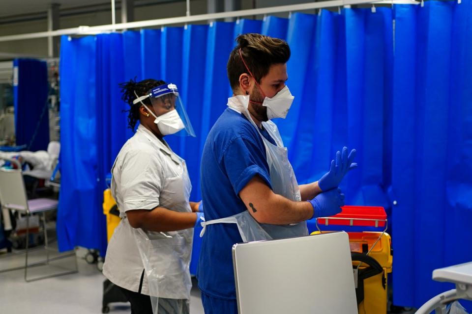 Medical staff wearing face masks in a critical care unit at King’s College Hospital, in London (Victoria Jones/PA) (PA Wire)