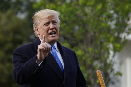 FILE PHOTO: U.S. President Donald Trump speaks during a tree planting ceremony with French President Emmanuel Macron on the South Lawn of the White House in Washington, U.S., April 23, 2018.