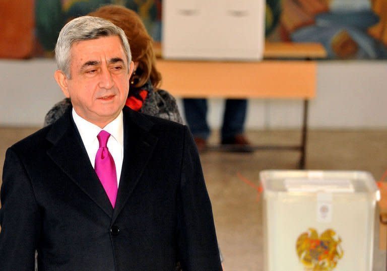 Armenian President Serzh Sarkisian votes at a poling station in Yerevan, on February 18, 2013. Sarkisian was set to win Armenia's presidential election with over 58 percent of the vote, according to near-total official results, with his main rival crying foul early Tuesday