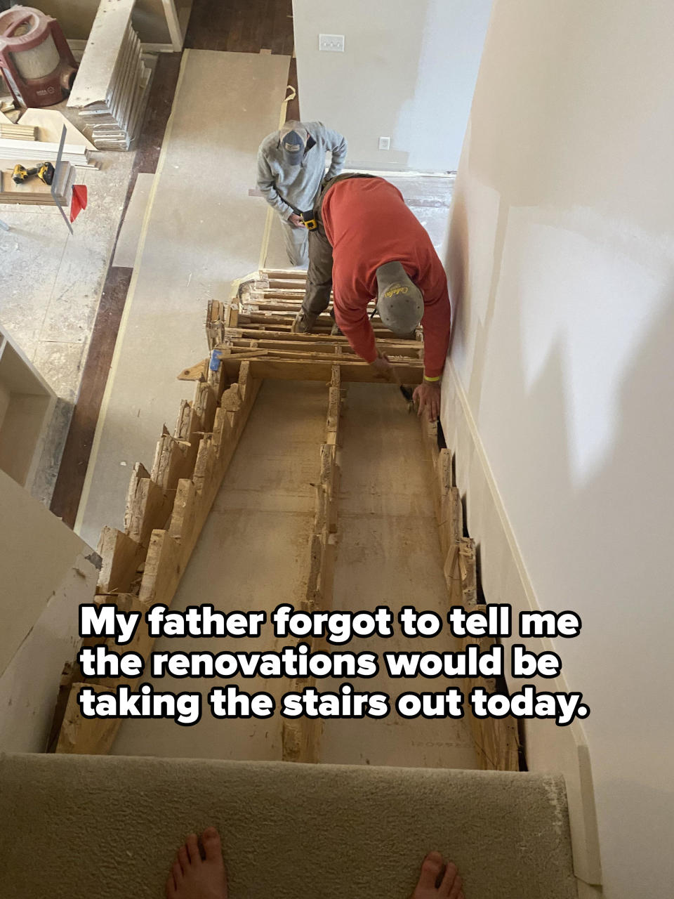 Person at top of stairs that have been dismantled