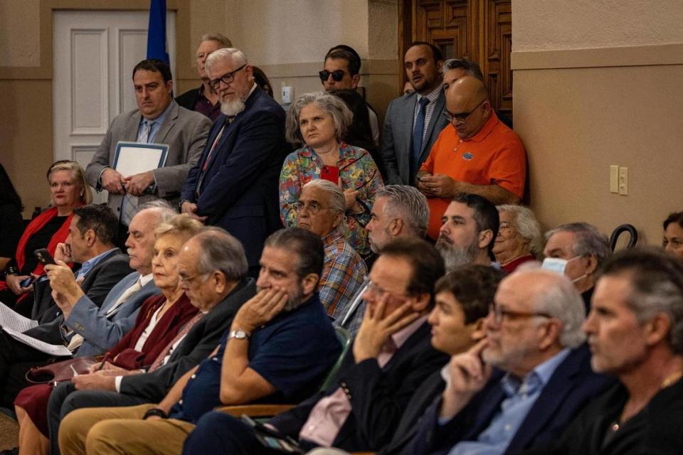 A standing-room-only crowd listens at the Coral Gables City Commission meeting on Tuesday.