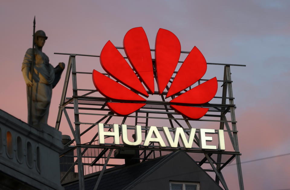 The logo of the Chinese telecommunications giant Huawei Technologies is pictured next to a statue on top of a building in Copenhagen, Denmark, June 23, 2021. REUTERS/Wolfgang Rattay - RC2J6O9U7F43