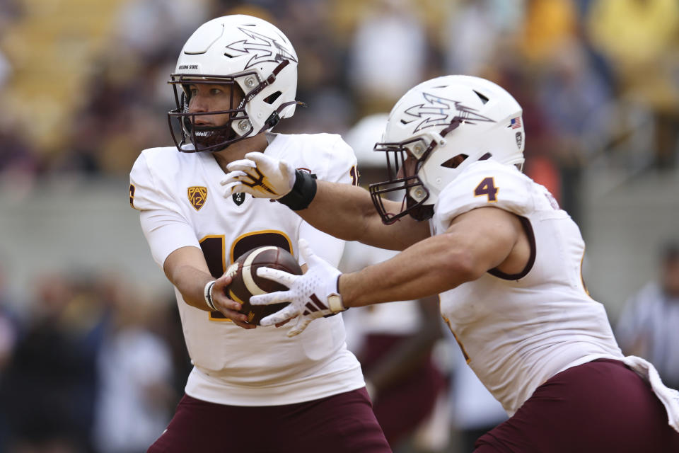 Arizona State quarterback Trenton Bourguet (16) hands off to Arizona State running back Cameron Skattebo (4) against California during the first half of an NCAA college football game in Berkeley, Calif., Saturday, Sept. 30, 2023. (AP Photo/Jed Jacobsohn)