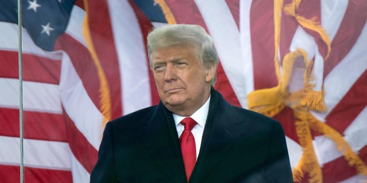 Trump in front of US flags on January 6