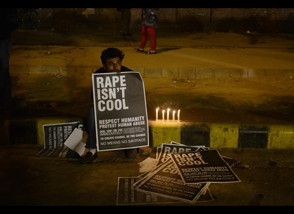 An Indian protester holds placards during a rally in New Delhi on December 31,2012. The family of an Indian gang-rape victim said they would not rest until her killers are hanged as they spoke of their own pain and trauma over a crime that has united the country in grief.(SAJJAD HUSSAIN/AFP/Getty Images)