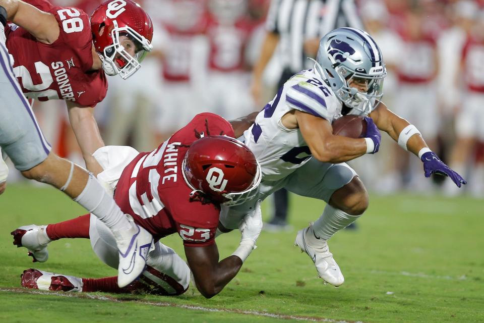 OU's DaShaun White drags down Kansas State tailback Deuce Vaughn last Saturday. BRYAN TERRY/The Oklahoman