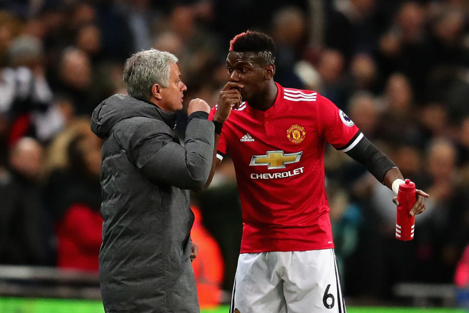 Jose Mourinho and Paul Pogba during the Premier League match between Tottenham Hotspur and Manchester United at Wembley Stadium on January 31, 2018 in London, England.