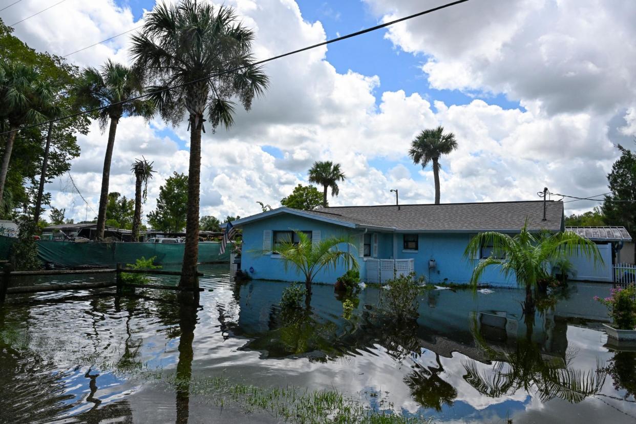 <span>A flooded house in Crystal River, Florida, on 31 August 2023, after Hurricane Idalia made landfall.</span><span>Photograph: Chandan Khanna/AFP/Getty Images</span>
