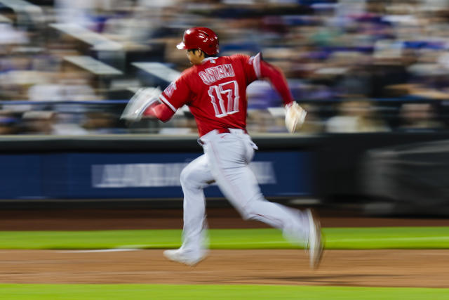 Los Angeles Angels designated hitter Shohei Ohtani arrives in the dugout  before the start of a baseball game against the New York Mets, Saturday,  Aug. 26, 2023, in New York. (AP Photo/Bebeto