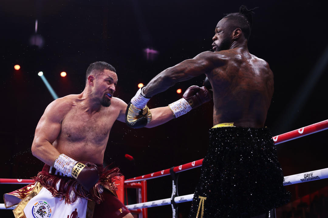 RIYADH, SAUDI ARABIA - DECEMBER 23: Deontay Wilder and Joseph Parker exchange punches during the WBC International & WBO Intercontinental Heavyweight title fight between Deontay Wilder and Joseph Parker during the Day of Reckoning: Fight Night at Kingdom Arena on December 23, 2023 in Riyadh, Saudi Arabia. (Photo by Richard Pelham/Getty Images)