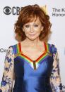 <p>While Reba’s collar looks like it was made for the outfit, it’s actually a symbol of her <a href="https://www.countryliving.com/life/entertainment/a25379914/kelly-clarkson-reba-mcentire-kennedy-center-honors-speech/" rel="nofollow noopener" target="_blank" data-ylk="slk:Kennedy Center Honor.;elm:context_link;itc:0;sec:content-canvas" class="link ">Kennedy Center Honor. </a></p>
