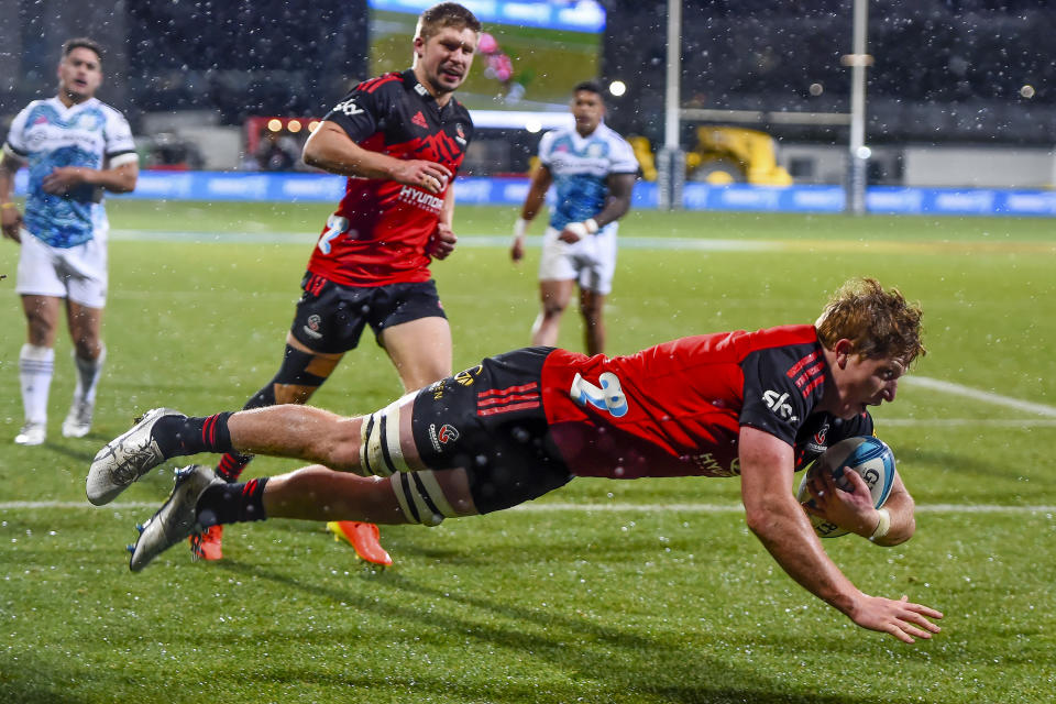 Cullen Grace of the Crusaders scores a try during the Super Rugby Pacific semifinal against the Chiefs in Christchurch, New Zealand, Friday, June 10, 2022. (John Davidson/AAP Image via AP)