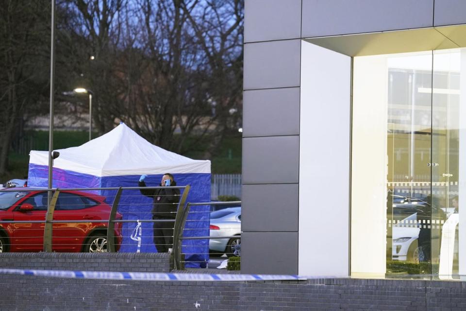 A police tent outside Vertu Jaguar Leeds dealership in Scott Hall Road (PA Wire)