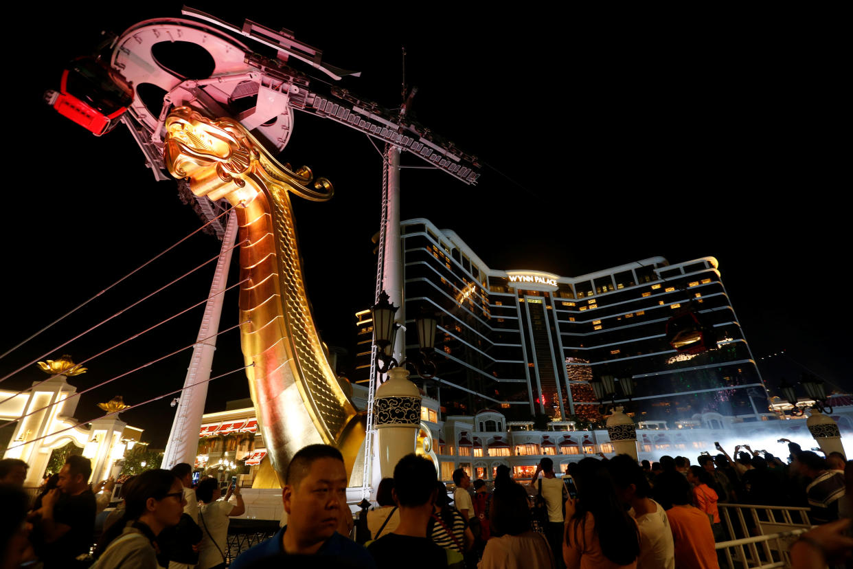 People wait to get in outside Wynn Palace, U.S. casino tycoon Steve Wynn's newest resort, during its opening in Macau, China August 22, 2016.  REUTERS/Bobby Yip