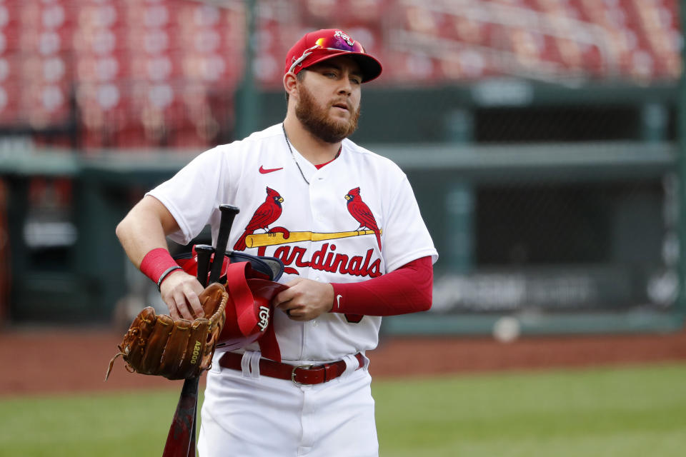 St. Louis Cardinals' Austin Dean carries his gear before an intrasquad practice baseball game at Busch Stadium Thursday, July 9, 2020, in St. Louis. (AP Photo/Jeff Roberson)