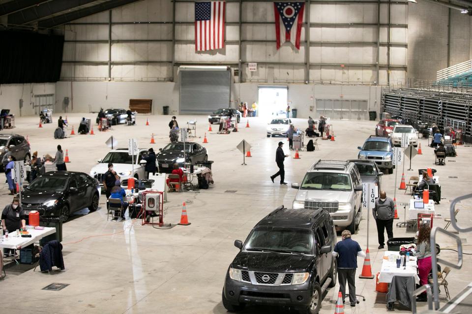 Cars line up for the two day event at the vaccine clinic run by Columbus Public Health, Wednesday, January 19, 2022, at the Celeste Center. The clinic is open Wednesday and Thursday 9AM - 6PM, and does not require appointments. 