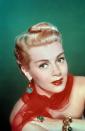 <p>A trend that carried over from the '40s, victory rolls were tight and voluminous curls set on the top of the head for a sleek and sophisticated look. Actresses like Lana Taylor wore this look when they wanted to add a touch of glamour. </p><p><strong>RECOMMENDED:</strong> <a href="https://www.goodhousekeeping.com/beauty/hair/g3471/most-popular-hairstyles-of-all-time/" rel="nofollow noopener" target="_blank" data-ylk="slk:The Trendiest Hairstyle the Year You Were Born;elm:context_link;itc:0;sec:content-canvas" class="link ">The Trendiest Hairstyle the Year You Were Born</a></p>