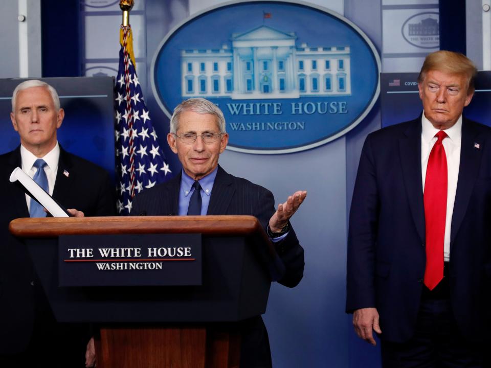 FILE - In this April 17, 2020, file photo, President Donald Trump and Vice President Mike Pence listen as Dr. Anthony Fauci, director of the National Institute of Allergy and Infectious Diseases, speaks about the coronavirus in the James Brady Press Briefing Room of the White House in Washington. The Trump administration’s leading health experts on safely dealing with the novel coronavirus will be testifying in a Senate hearing by a videoconference after three of them and the committee's chairman were exposed to someone who tested positive for COVID-19. (AP Photo/Alex Brandon, File)