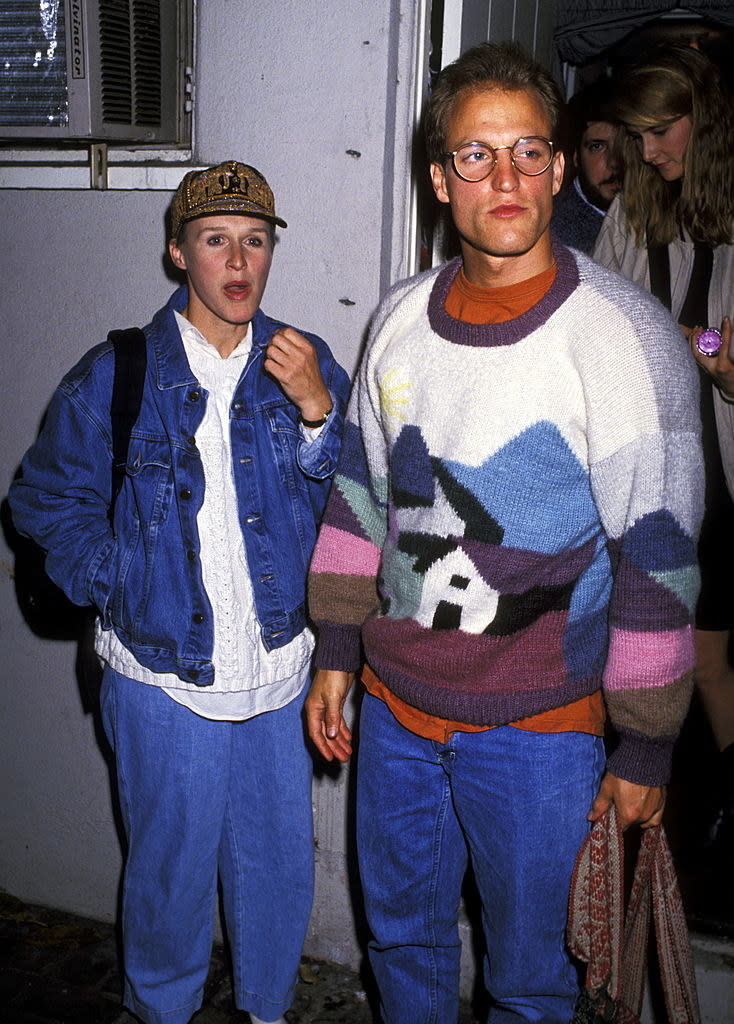 Wearing a very cozy sweater and standing next to Glenn Close in the early '90s