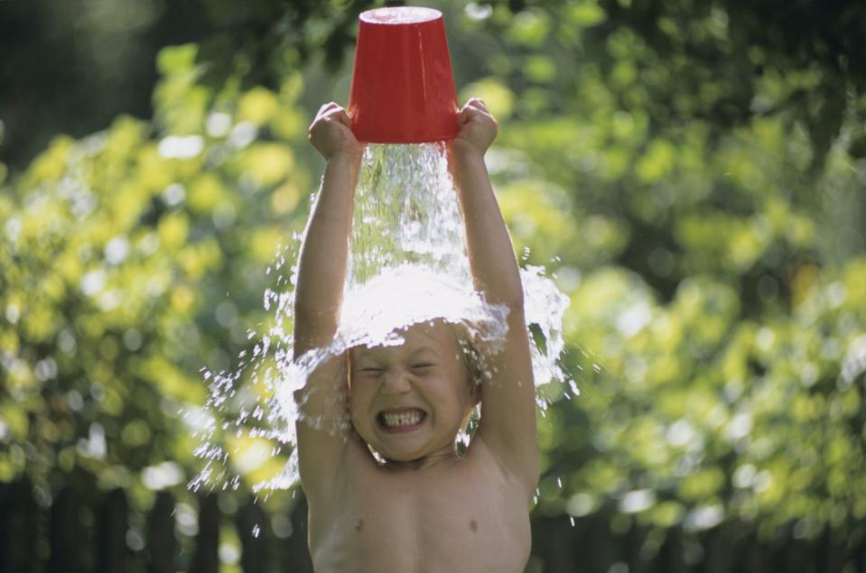 The way heat and humidity affect people depends on factors like the weather that's typical where they are. <a href="https://www.gettyimages.com/detail/photo/boy-pouring-water-over-head-outdoors-royalty-free-image/56323439" rel="nofollow noopener" target="_blank" data-ylk="slk:Hans Huber/Westend61 via Getty Images;elm:context_link;itc:0;sec:content-canvas" class="link ">Hans Huber/Westend61 via Getty Images</a>