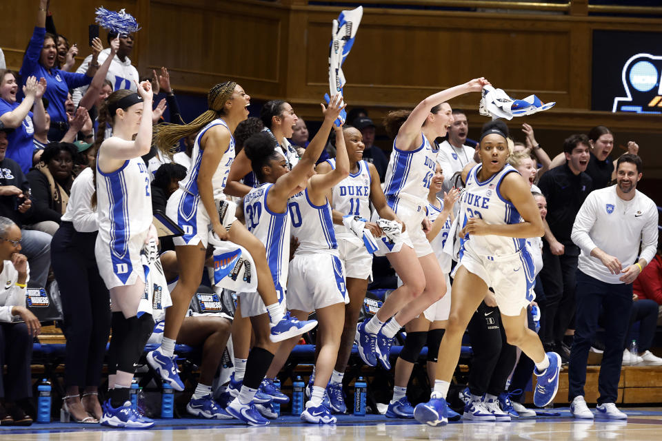 Duke players begin to celebrate during the closing minutes of the second half of a first-round college basketball game of the NCAA Tournament against Iona, Saturday, March 18, 2023, in Durham, N.C. (AP Photo/Karl B. DeBlaker)