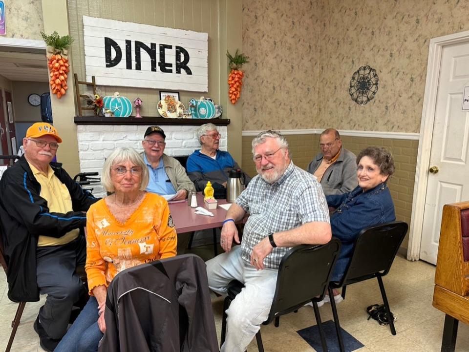 I (D. Ray Smith) am pleased to have been invited to join the breakfast with Mary Luttrell, seated to my front facing the camera, Jimmy Luttrell beside Mary, Rick Young to his left, Benita Albert’s husband, Mark (also a Vietnam veteran), Tommy Ethridge, and finally, Judy Clevenger at my back,