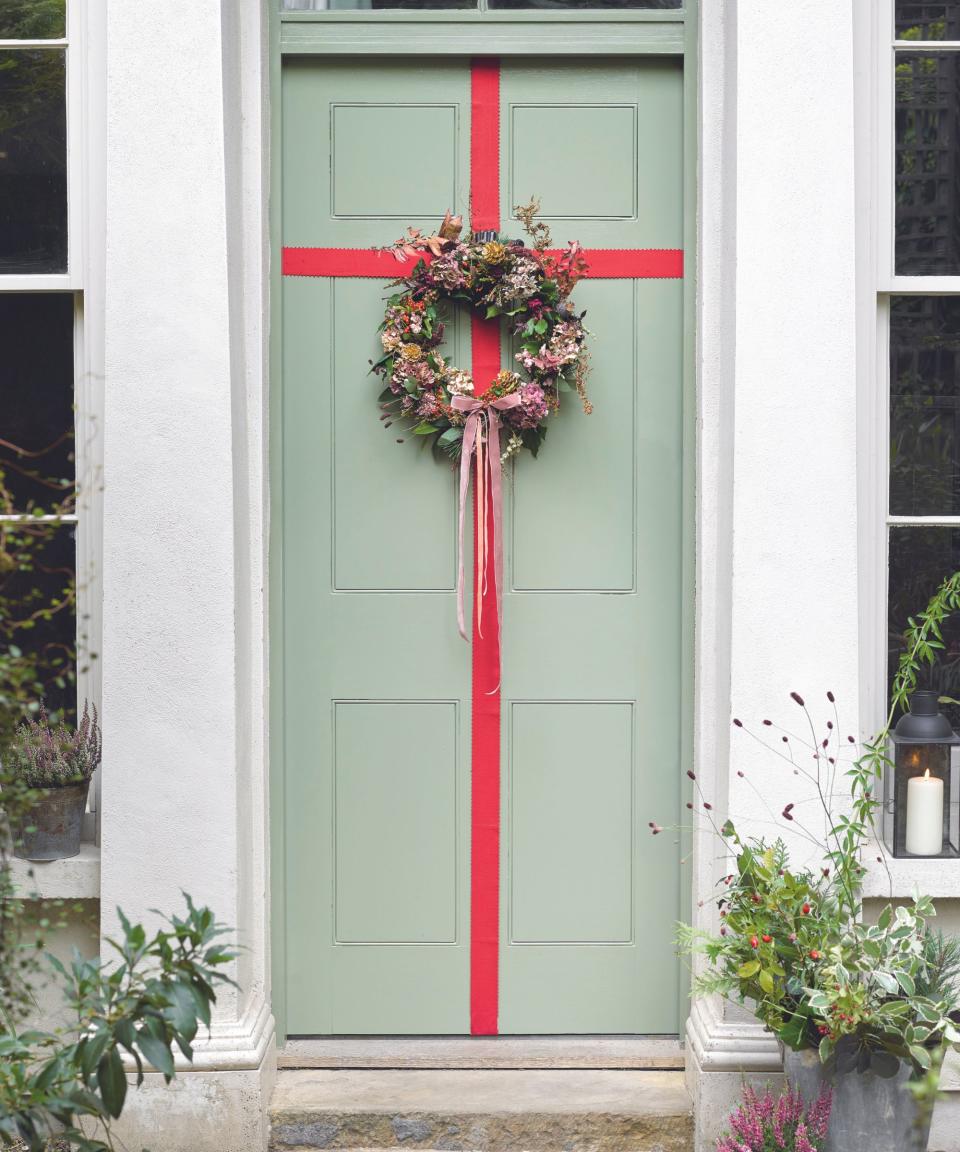 <p> There’s no denying door bows have been a huge seasonal trend the last few years, yet some might say they’re a little on the gimmicky side. However, if done right, they can look really elegant, and adding a classy wreath is one way to ensure that’s the case. Don’t be shy about making a statement – you can get away with it at Christmas! </p> <p> Start by ‘wrapping’ the door in a tactile ribbon that stands out against your door color, then gather foliage favorites to create a beautiful wreath. Adding complementing wreath ribbon ideas makes for a lovely finishing touch – you could either match the ribbon on the door, or choose a contrasting shade for impact. </p>