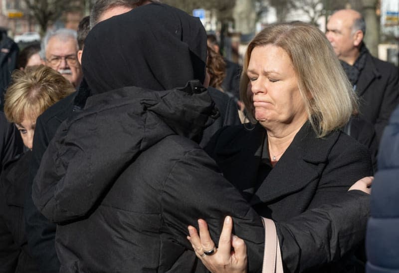 German Minister of the Interior Nancy Faeser hugs a woman at a memorial service for the victims of the racist attack in Hanau. On February 19, 2020, a racist shot nine people before also killing his mother and himself. Boris Roessler/dpa