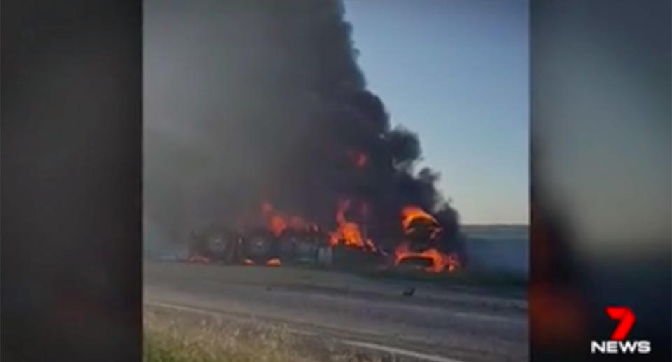 One truck was upside down and on fire, with the father and son trapped inside. Source: 7News