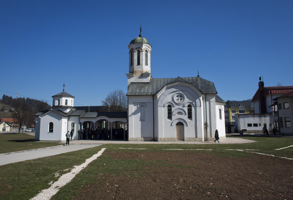 In this Sunday, March 17, 2019 photo, a church service is held at an Orthodox church in the Bosnian Serb wartime stronghold of Pale, Bosnia-Herzegovina. Nearly a quarter of a century since Bosnia's devastating war ended, former Bosnian Serb leader Radovan Karadzic is set to hear the final judgment on whether he can be held criminally responsible for unleashing a wave of murder and mistreatment by his administration's forces. United Nations appeals judges on Wednesday March 20, 2019 will decide whether to uphold or overturn Karadzic's 2016 convictions for genocide, crimes against humanity and war crimes and his 40-year sentence. (AP Photo/Darko Bandic)