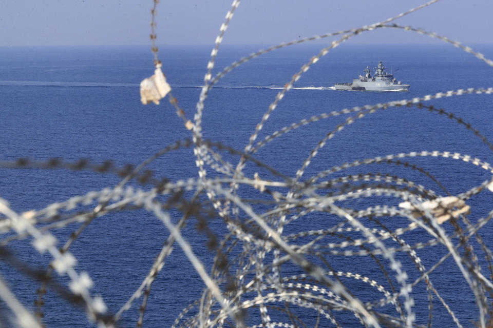 File - A UNIFIL Navy vessel seen through barbed wires patrols in the Mediterranean Sea, next of a U.N. post along the border known as Ras Naqoura, where Lebanese and Israeli delegations are going to meet, off the southern town of Naqoura, Lebanon, Thursday, Oct. 27, 2022. Lebanon signed and delivered its copy of a U.S.-mediated sea border deal with Israel on Thursday to a U.S. mediator, hoping to soon start exploring gas in its southern maritime blocs to bring economic stability to the crisis-ridden country. (AP Photo/Mohammed Zaatari, File)