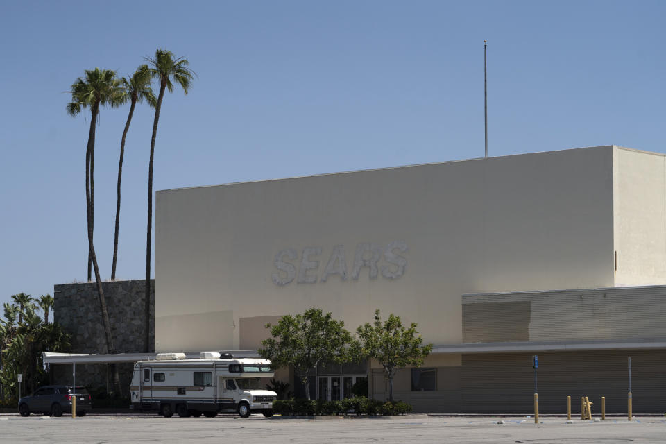 This Thursday, May 27, 2021, photo shows the closed Sears in Buena Park Mall in Buena Park, Calif. California state lawmakers are grappling with a particularly 21st-century problem: What to do with the growing number of shopping malls and big-box retail stores left empty by consumers shifting their purchases to the web. A possible answer in crowded California cities is to build housing on these sites, which already have ample parking and are close to existing neighborhoods. (AP Photo/Damian Dovarganes)