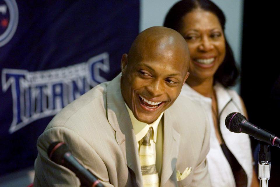 Eddie George and his mother, Donna, were all smiles after the running back announces his signing a 6-year, $42 million contract extension with the Tennessee Titans at a press conference at the team headquarters July 18, 2000.